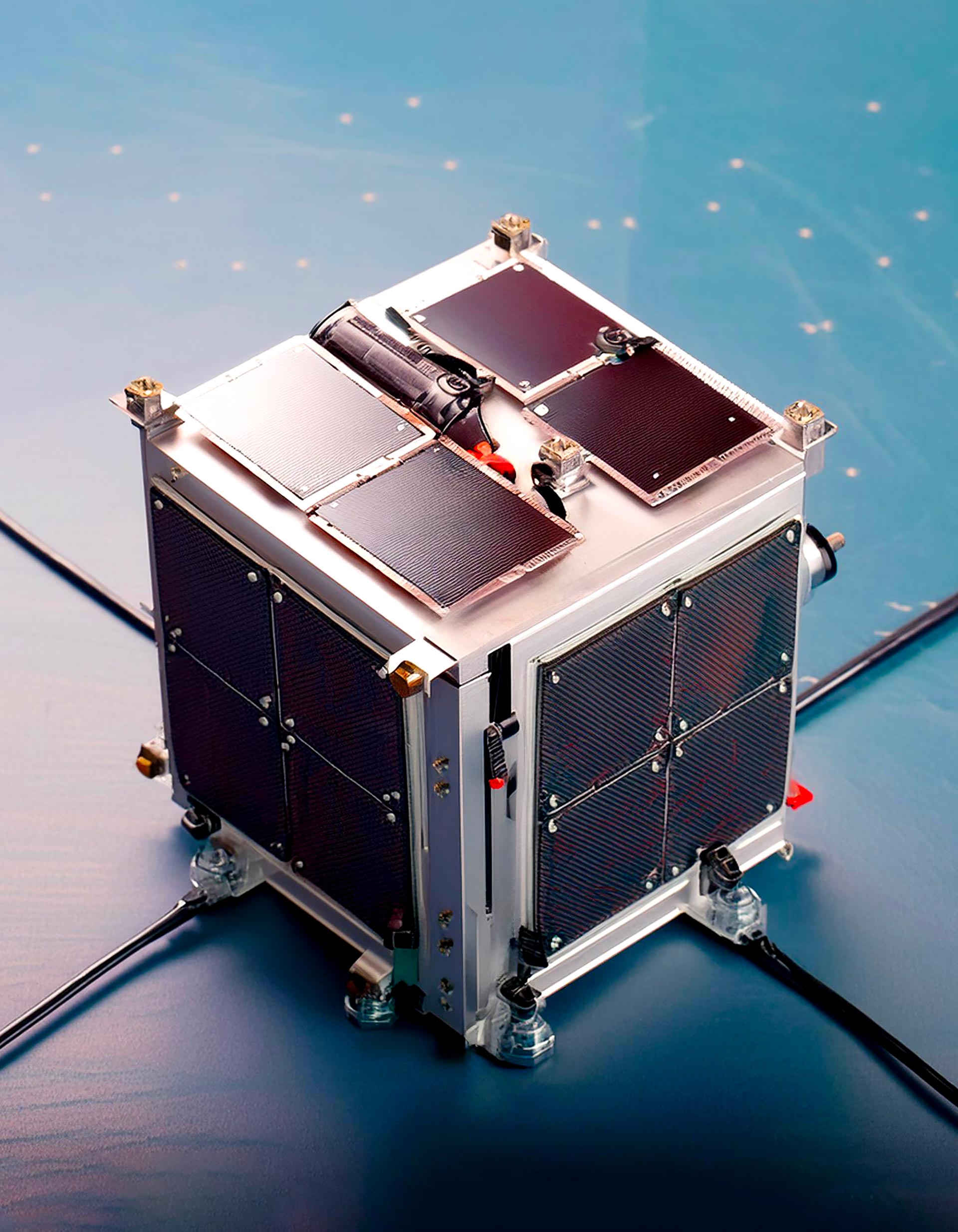 Metal cube with solar panels on the walls standing on a blue background